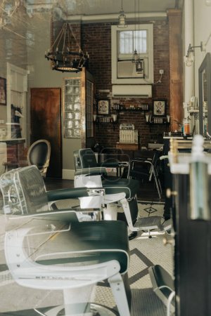 Photo for A vertical shot of an oldschool barbershop with a brick wall and wooden details - Royalty Free Image