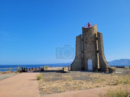 Photo for A pathway in a landscape with Cap de Cervera Lighthouse and sea in the background - Royalty Free Image