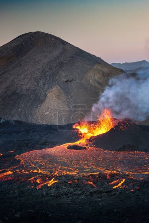 Photo for A vertical view of an erupting Fagradalsfjall volcano in Iceland - Royalty Free Image