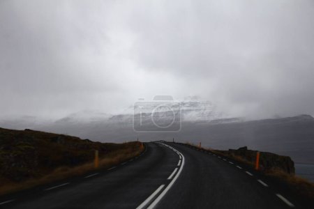 Photo for An aerial view of road surrounded by mountains - Royalty Free Image