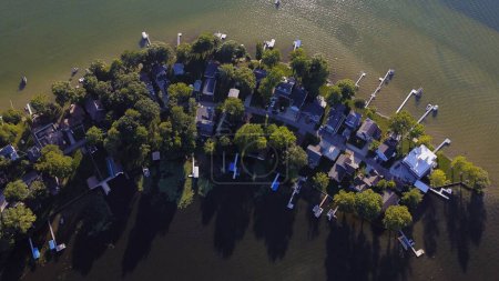 Photo for Aerial view of cozy cottages along the shore of Gun lake, Michigan, USA - Royalty Free Image