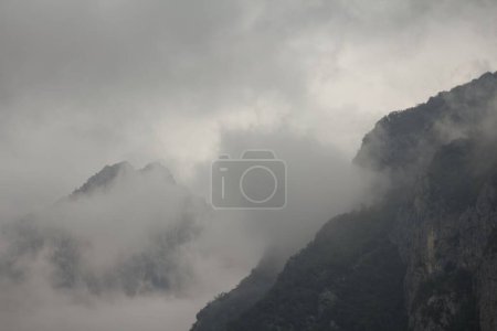 Photo for An aerial view of mountain landscape surrounded by clouds - Royalty Free Image