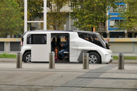 Photo for The view of people sitting in a white ETIOCA full electric minivan taxi - Royalty Free Image