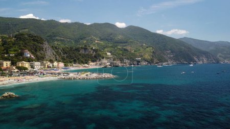 Photo for An aerial drone shot of a blue sea in the town of Monterosso al Mare, La Spezia, Italy - Royalty Free Image