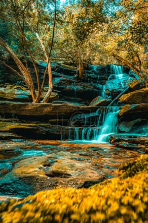 Photo for A vertical shot of the Somersby Falls on a sunny day in Somersby town in New South Wales, Australia - Royalty Free Image