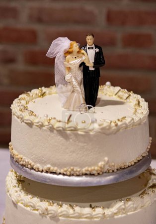 Photo for A wedding cake with groom and bride - Royalty Free Image