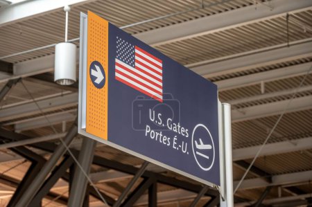 Photo for Ottawa, Ontario - October 21, 2022: U.S. gates sign on the departures level of the Ottawa International Airport. - Royalty Free Image
