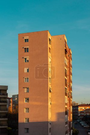Photo for A vertical shot of a minimalist residential building in an urban neighborhood - Royalty Free Image