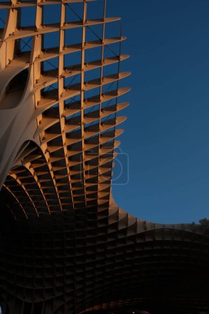 Photo for The sculptural wooden roof of the Setas de Sevilla (Metropol Parasol) under blue sky in Seville, Spain - Royalty Free Image