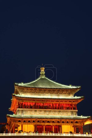 Photo for A vertical shot of the ancient traditional city tower of Xi'an, China at night - Royalty Free Image