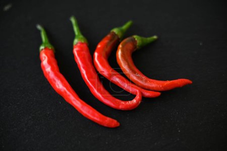 Photo for A top view of red peppers on the dark background - Royalty Free Image