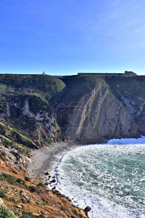 Photo for Dramatic cliffs at Cape Espichel on coast of Atlantic Ocean. The location is famous for the sanctuary complex, Portugal. - Royalty Free Image