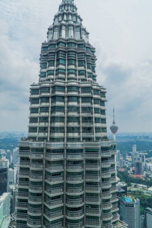 Photo for An closeup of the Petronas Towers on a gloomy day, Kuala Lumpur, Malaysia - Royalty Free Image