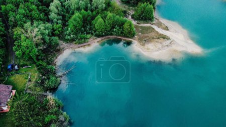 Photo for An aerial view of a landscape with lake and trees around - Royalty Free Image