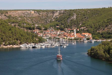Photo for An aerial view of a boat sailing on Krka river in Skradin, Croatia - Royalty Free Image