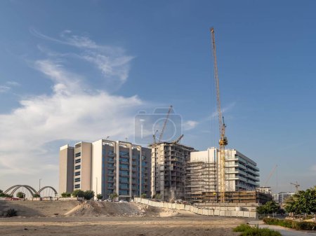 Photo for Residential apartment buildings under construction in Al Raha Beach, Abu Dhabi - Royalty Free Image