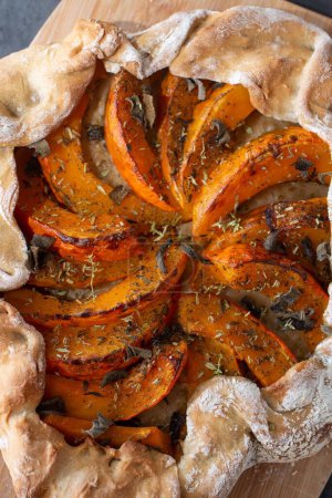 Photo for A vertical shot of a tasty homemade pumpkin quiche tart - Royalty Free Image
