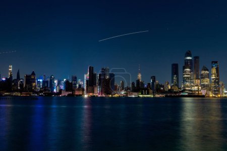 Photo for A scenic view of the New York City illuminated at night - Royalty Free Image
