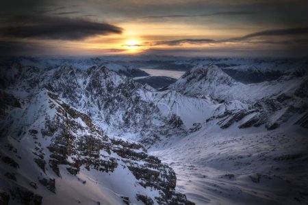 Photo for A daytime scenic view of the snow covered Zugspitze peak in Germany during sunset - Royalty Free Image