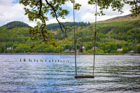 Photo for A swing seat hanging over the Scottish loch. - Royalty Free Image