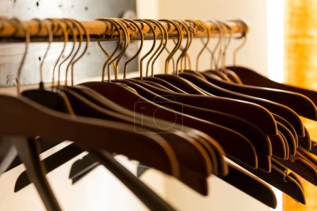 Photo for A closeup view of wooden suit hangers - Royalty Free Image
