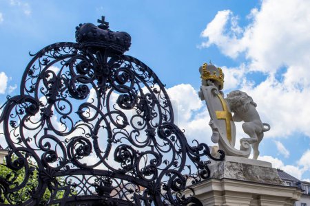 Photo for A black gate and a lion statue in the city of Vienna, Austria on a bright sunny day - Royalty Free Image
