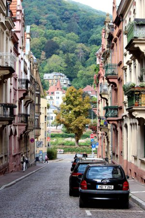 Photo for A vertical shot of a street in Heidelberg with a forested mountain in the background - Royalty Free Image