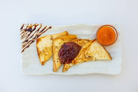 Photo for A top-view of fried French toast with jam and on a plate - Royalty Free Image