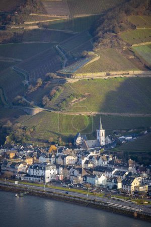 Photo for A vertical aerial of the small village of Assmanshausen on the foot of the Rhine valley in Germany - Royalty Free Image