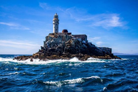 Photo for A scenic view of Fastnet lighthouse located on a rocky island in County Cork, Ireland - Royalty Free Image