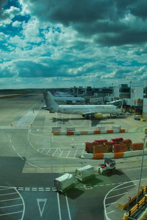 Photo for A vertical shot of planes stopped at Gatwick airport in London, United Kingdom - Royalty Free Image