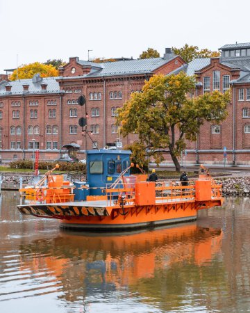 Photo for A vertical shot of a Fori ferry in Aura river in autumn in Turku, Finland - Royalty Free Image