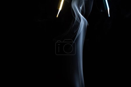 Photo for Sharp yellow and green pencils with smoke on black background - Royalty Free Image