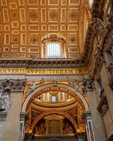 Photo for A vertical shot of the interior of Saint Peter's Basilica with a window above an arch - Royalty Free Image
