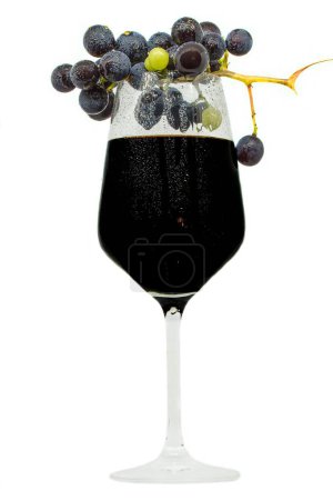 Photo for A closeup of grapes on glass of wine on a white background - Royalty Free Image