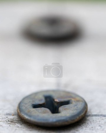Photo for A vertical closeup shot of a rusty screw - Royalty Free Image