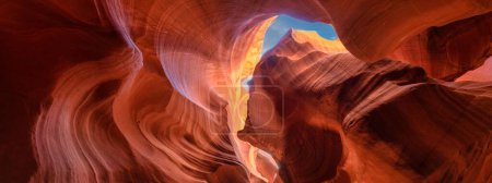 Photo for A Panoramic shot of multicolored sandstone formations in a Canyon on a sunny day under the blue sky - Royalty Free Image