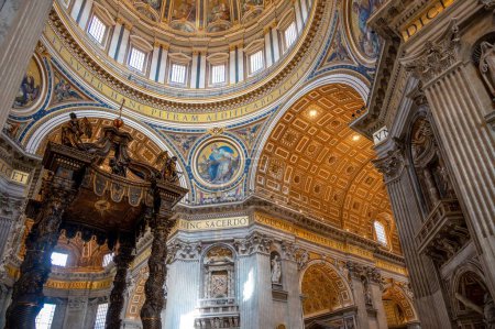 Photo for The interior of Saint Peter's Basilica wind a round dome and notes on the walls - Royalty Free Image