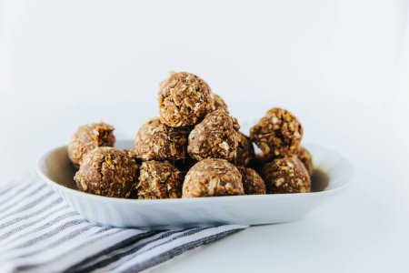 Photo for A closeup shot of rolled no bake cookies on a white plate - Royalty Free Image