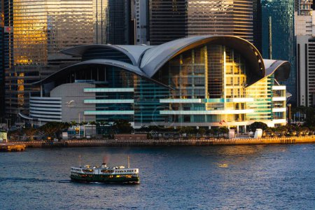 Photo for The sunset over the Hong Kong convention center with the star ferry in front - Royalty Free Image
