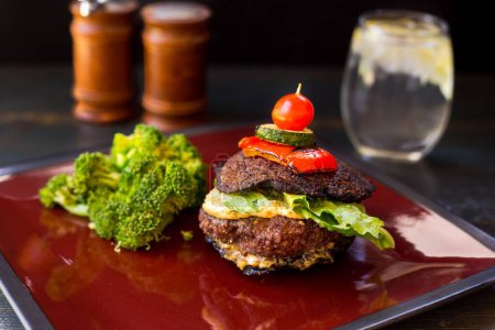Photo for A closeup of Bunless Hamburger on plate - Royalty Free Image