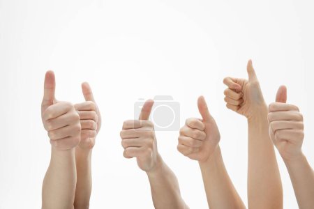 Photo for A closeup shot of a bunch of hands showing good reviews - Royalty Free Image