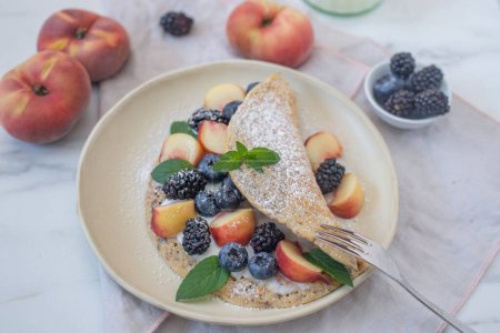 Photo for A beautiful view of a berry pancake on white plate - Royalty Free Image