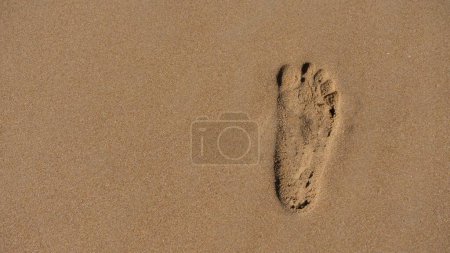 Photo for A footprint on the sand beach. Good for backgrounds - Royalty Free Image