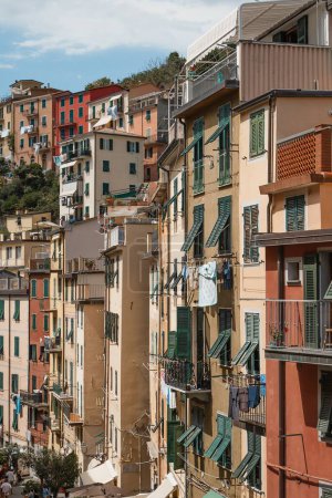 Photo for An outdoor view of residential buildings in the town of Riomaggiore, Cinque Terre in Italy - Royalty Free Image