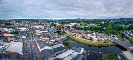 Photo for An aerial view of cityscape Omagh surrounded by dense trees - Royalty Free Image