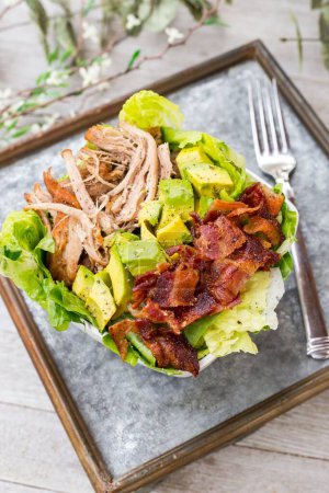 Photo for A bowl of BLT salad with lettuce, meat, bacon and avocados - Royalty Free Image