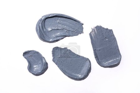 Foto de Las muestras de textura de carbón gris con diferentes formas sobre un fondo blanco - Imagen libre de derechos