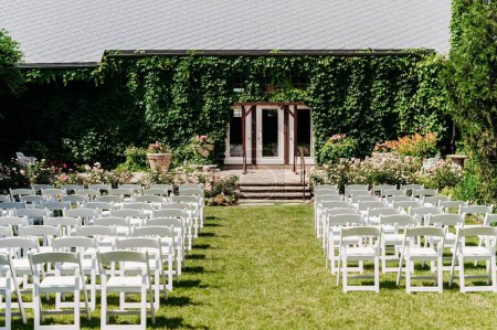 Photo for The rows of chairs on the lawn outside for a wedding ceremony - Royalty Free Image