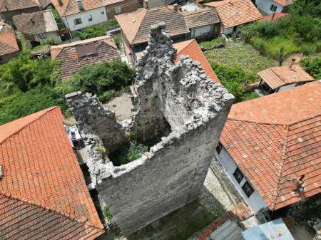 Photo for A bird's eye view of ancient ruins near residential buildings - Royalty Free Image